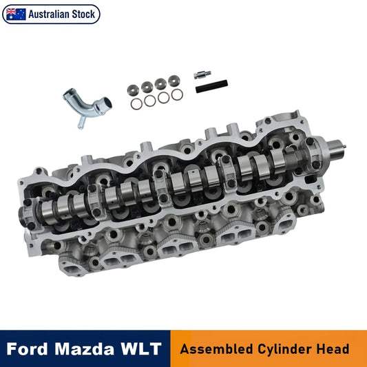 Ford and Mazda WLT assembled cylinder head shown in a cutaway view with cam lobes, accompanied by small hardware parts, on a white background with 'Australian Stock' badge and 'Ford Mazda WLT Assembled Cylinder Head' text banners.