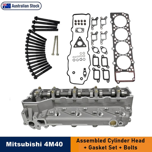 Mitsubishi 4M40 assembled cylinder head kit with gasket set and bolts, displayed on a white background with product parts arranged above the assembled cylinder head. An 'Australian Stock' badge appears at the top left, and a blue and orange banner at the bottom reads 'Mitsubishi 4M40 Assembled Cylinder Head + Gasket Set + Bolts'.