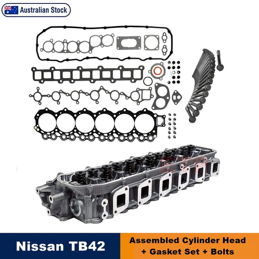 Nissan TB42 cylinder head gasket kit components arranged on a white background, including an assembled cylinder head, multiple gaskets, seals, washers, and bolts. Text overlays indicate 'Australian Stock' and 'Nissan TB42 Assembled Cylinder Head + Gasket Set + Bolts'.