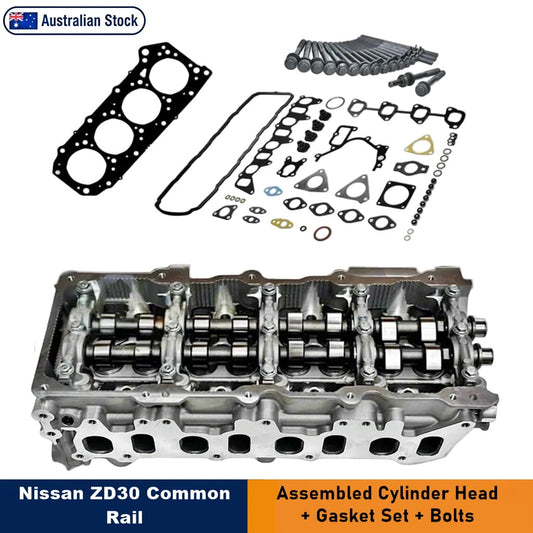 Nissan ZD30 Common Rail Cylinder Head Kit, featuring an assembled cylinder head and gasket set, displayed against a white background with text overlays. A variety of black-and-gold gaskets, seals, and bolts are arranged above the cylinder head on the same white background. An "Australian Stock" badge sits in the top-left corner. Text overlays highlight "Nissan ZD30 Common Rail" and "Assembled Cylinder Head + Gasket Set + Bolts."